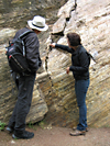 Admiring a rock wall